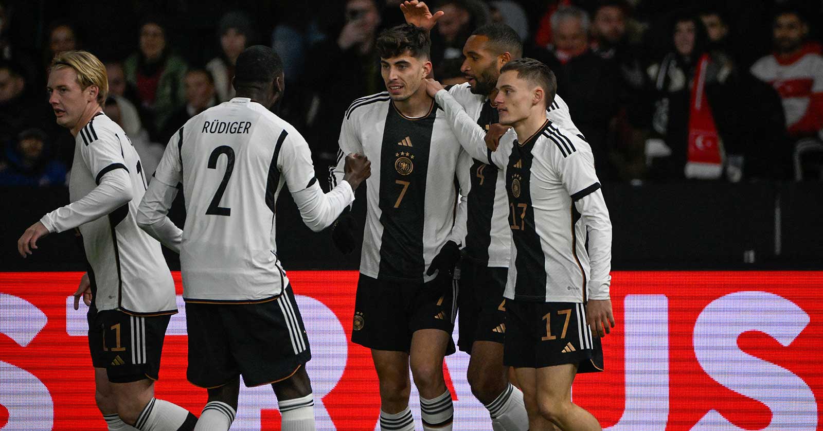 Germany's midfielder #07 Kai Havertz (C) celebrates scoring the opening goal with his teammates during the international friendly football match between Germany and Turkey at the Olympic Stadium in Berlin on November 18, 2023, in preparation for the UEFA Euro 2024 in Germany. (Photo by Tobias SCHWARZ / AFP)