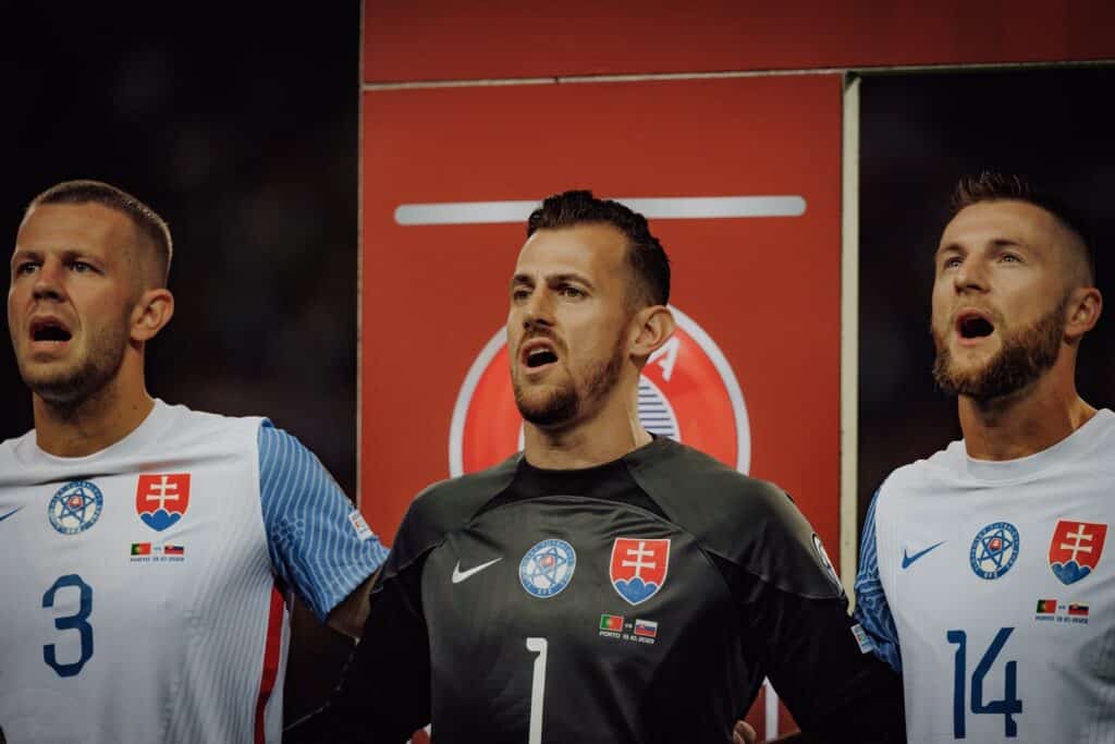 Denis Vavro, Martin Dubravka, Milan Skriniar sing anthem during UEFA Euro 2024 qualifying game between national teams of Portugal and Slovakia at Estadio do Dragao, Porto. (Maciej Rogowski)(Copyright depositphotos.com)